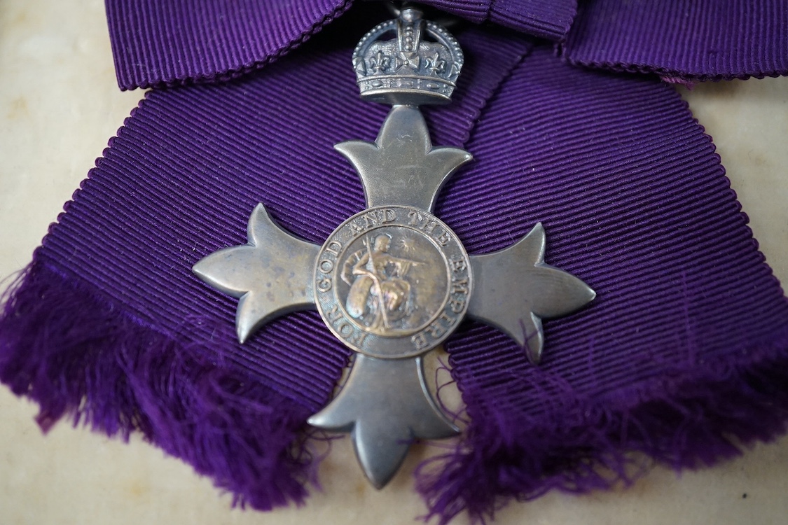 A civilian OBE with ladies bow ribbon, hallmarked for London 1929 in a Garrard’s fitted case, together with a small collection of Royal memorabilia relating to the coronation and death of George VI. Condition - fair, hin